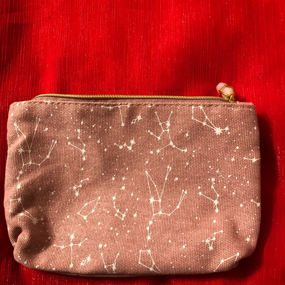 Cute little makeup bag and moisturizer sample